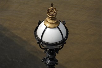 Detail of a lantern with crown on Queen's Walk on the Thames, London, England, Great Britain