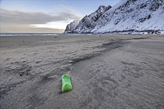 Empty plastic bottle on the beach, plastic waste, Senja, Troms, Norway, Europe