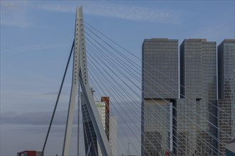 Bridge with modern skyscrapers in the background under a blue sky, skyline of a modern city on a