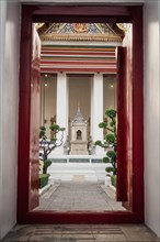 Entrance door to the temple with a view of the shrine, colourfully decorated details. Taken at