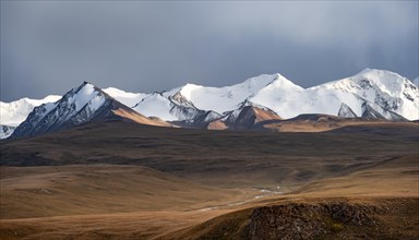 Glaciated and snow-capped mountains, dramatic landscape, high plateau, autumnal mountain landscape
