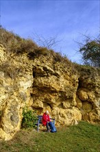 Hiker at the Burschel geotope, Riesse limestones, Hainsfarth, Ries crater rim, Noerdlinger Ries,
