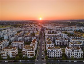 The sun rises over the Riedberg district of Frankfurt. (Aerial view with a drone), Riedberg,