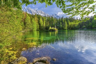Lake Badersee in spring with Zugspitze group 2962m in the Wetterstein mountains, Zugspitz village