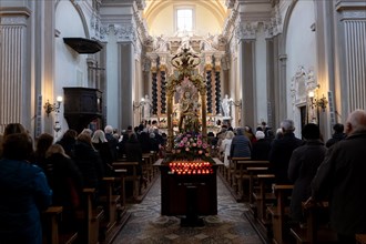 People Praying Inside the Church of San Nazzaro (Croglio) in Castelrotto, Ticino, Switzerland,