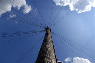 Telephone pole against blue sky in the suburb of London, Tooting Broadway, London, England, Great