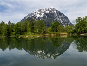 Grimming is reflected in See, Trautenfels near Liezen, Styria, Austria, Europe