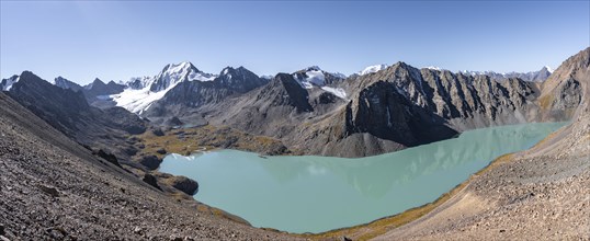 Panorama, view of mountains and glaciers and turquoise Ala Kul mountain lake, ascent to the Ala Kul