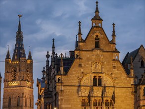 Detailed gothic architecture and a church tower in a historic city at night, historic buildings