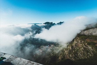 Breathtaking view of a mountain landscape with clouds below. Madeira, Portugal, Europe