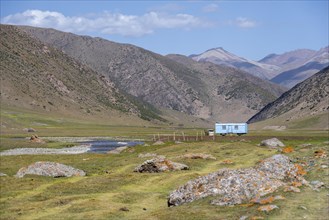 Construction trailer, caravan of Kyrgyz shepherds, mountain landscape in the Karkyra Valley,