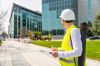 Horizontal photo with copy space of an architect supervising remodeling works in the city