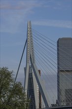 Close-up of a modern bridge with skyscrapers and blue sky in the background, skyline of a modern