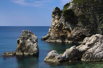 Cliffs and rocks in a clear blue sea under a cloudless sky Croatia