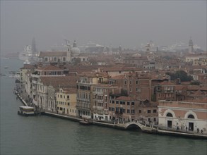 Panorama of Venice's canals and historic buildings in the fog, church towers and historic buildings