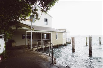 Fog over the water by the lake, Old Harbourside Restaurant in Tauranga, New Zealand, Oceania