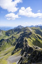 Mountain panorama at the summit of the Hochspitz or Monte Vacomun, view of the mountain ridge of