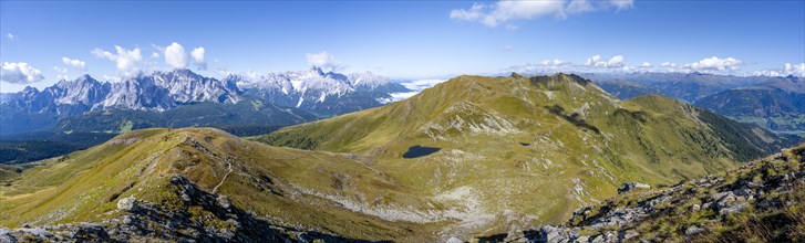 Panorama, hiking trail between green mountain meadows on a mountain ridge, mountain panorama, view