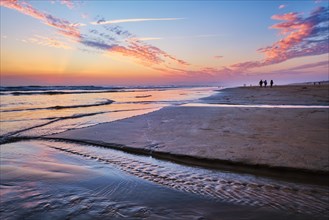 Atlantic ocean after sunset with surging waves at Fonte da Telha beach, Costa da Caparica,