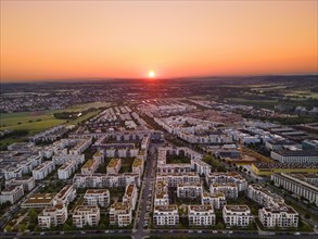 The sun rises over the Riedberg district of Frankfurt. (Aerial view with a drone), Riedberg,