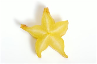 Star fruit or carambola (Averrhoa carambola), sliced fruit on a white background