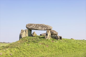 Passage grave on a hill from the Neolithic Age at a blue sky, Luttra, Falkoeping, Sweden, Europe