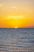 The sun sets behind the lake, sunset at Issyk Kul, Kyrgyzstan, Asia