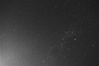 Starry sky in a black and white photograph showing the vastness of the universe