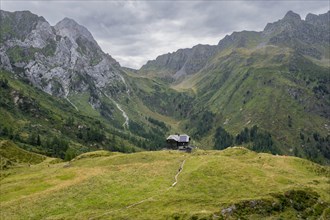 Alpine club hut, Hochweisssteinhaus mountain hut, mountain landscape with green mountain meadows