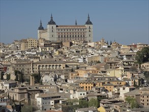 Close-up of a historic city with numerous buildings and striking church towers under a clear blue