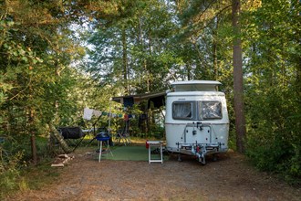 Eriba caravan on a campsite in the forest, Haettaboda Vildmarkscamping, Urshult, Sweden, Europe