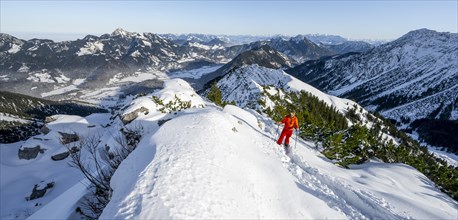 Mountaineer on the summit of the Aiplspitz in the snow, snow-covered mountain landscape with