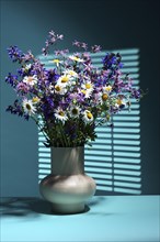 Vase with bouquet of wildflowers