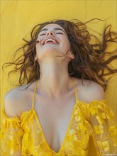 A caucasian woman in a yellow dress lying down, laughing with her hair spread out, AI generated