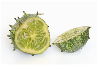 African horned melon (Cucumis metuliferus), sliced fruit on a white background