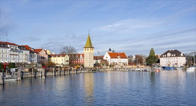 Harbour promenade with man tower, reflected in the lake, harbour, Lindau Island, Lake Constance,