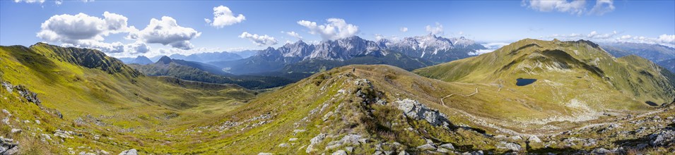Panorama, hiking trail between green mountain meadows on a mountain ridge, mountain panorama, view