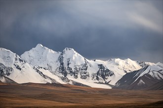 Glaciated and snow-capped mountains, dramatic landscape, high plateau, autumnal mountain landscape