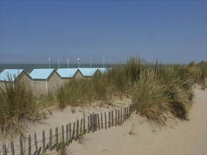 Small huts in the dunes on a beach in summertime, oostende, Belgium, Europe