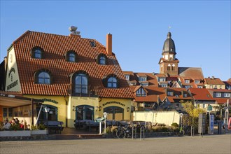 Town view with harbour restaurant and St. Marien church, Waren, Mueritz, Mecklenburg Lake District,