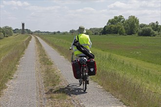 Cyclist, former watchtower, Elbe cycle path near Boizenburg, Mecklenburg-Western Pomerania,