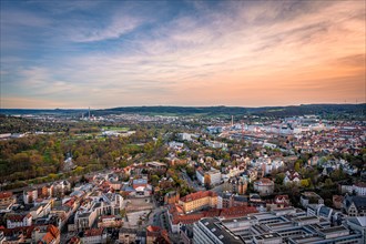 View over the city of Jena with the Kernberge in the background at sunset and blue sky, Jena,