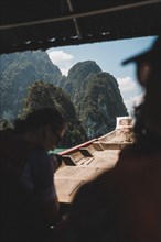 Interior view of a boat with a view of a mountain backdrop. Khao Sok National Park, Thailand, Asia