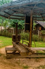 Traditional sesame seed mill and oil press in Thai cultural village in Chiang Khan, Thailand, Asia