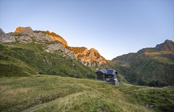 Alpine club hut, Hochweisssteinhaus mountain hut, mountain landscape with green mountain meadows
