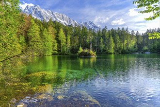 Lake Badersee in spring with Zugspitze group 2962m in the Wetterstein mountains, Zugspitz village