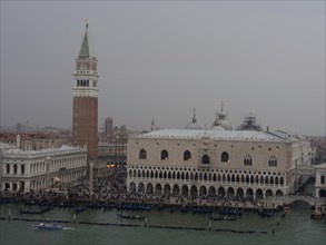 St Mark's Square in Venice with the Campanile and historic buildings, surrounded by water in a