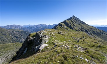 Hiking trail in idyllic mountain landscape, summit Steinkarspitz or Monte Antola, Carnic High