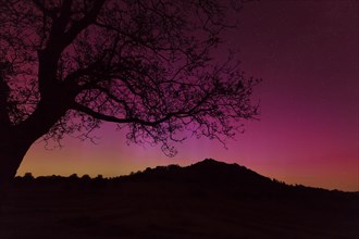 Northern lights in Germany. Very strong auroras over the Limburg near Weilheim, Swabian Alb. At 3