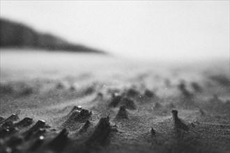 Close-up of sand waves on the beach in monochrome. Middelkerke, Belgium, Europe